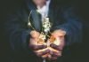 Upgrade Your Business Strategies With These Useful Tips And Tricks Man holding incandescent bulb
