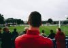 What A Good Betting Company Offers? Man standing while watching soccer during daytime