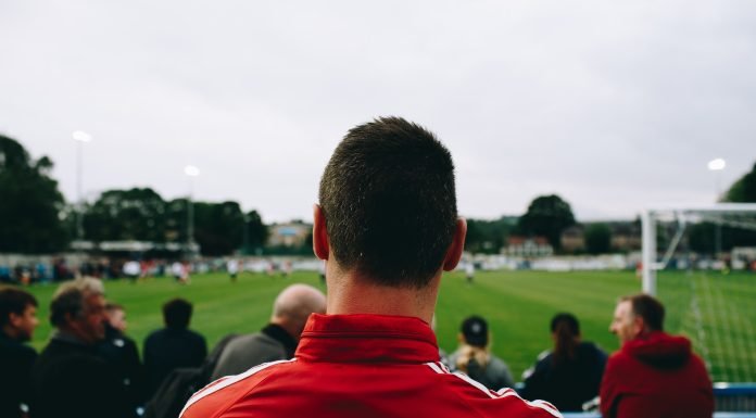 What A Good Betting Company Offers? Man standing while watching soccer during daytime